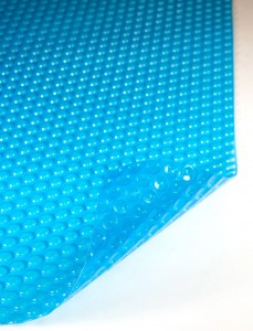 Quality solar bubble blanket lets sunlight warm the pool water Quality solar bubble blanket lets sunlight warm the pool water